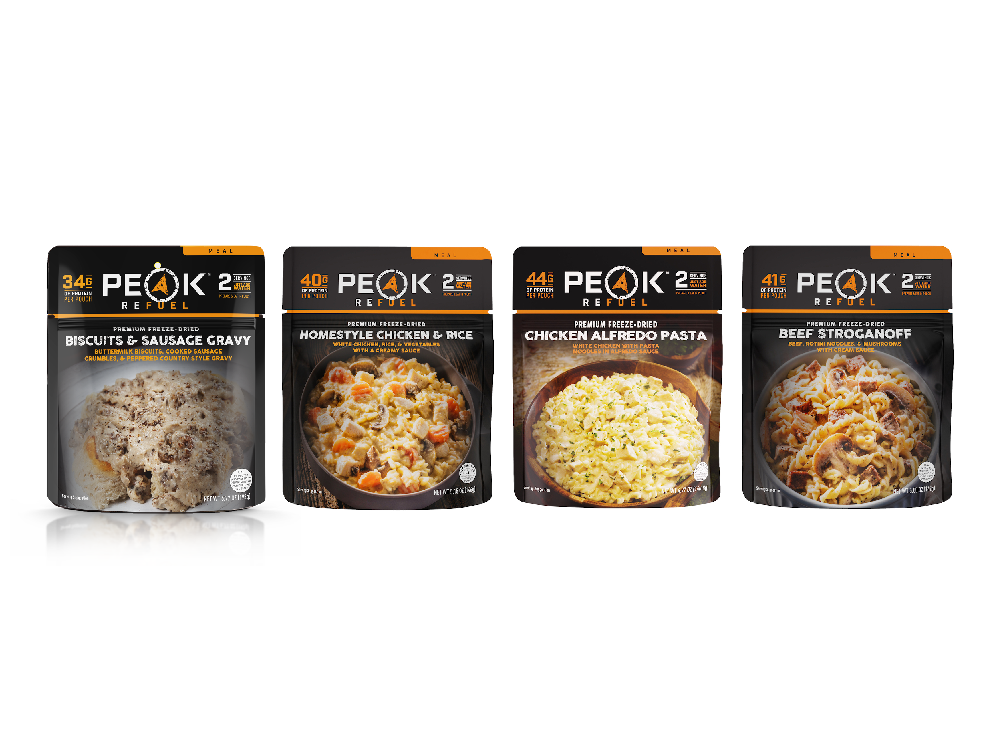 A group of prepackaged meals on a table, including a bowl of noodles with chicken and herbs, and a bowl of pasta with meat and mushrooms.